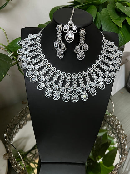 Bridal jewelry set AD necklace and earrings Diamond look alike jewelry High-end statement necklace Pastel pink stones Dangler earrings Mang tikka set Complete bridal look Wedding jewelry Indian bridal jewelry Artificial jewelry Fashion jewelry Costume jewelry AD bridal set Bridal accessories